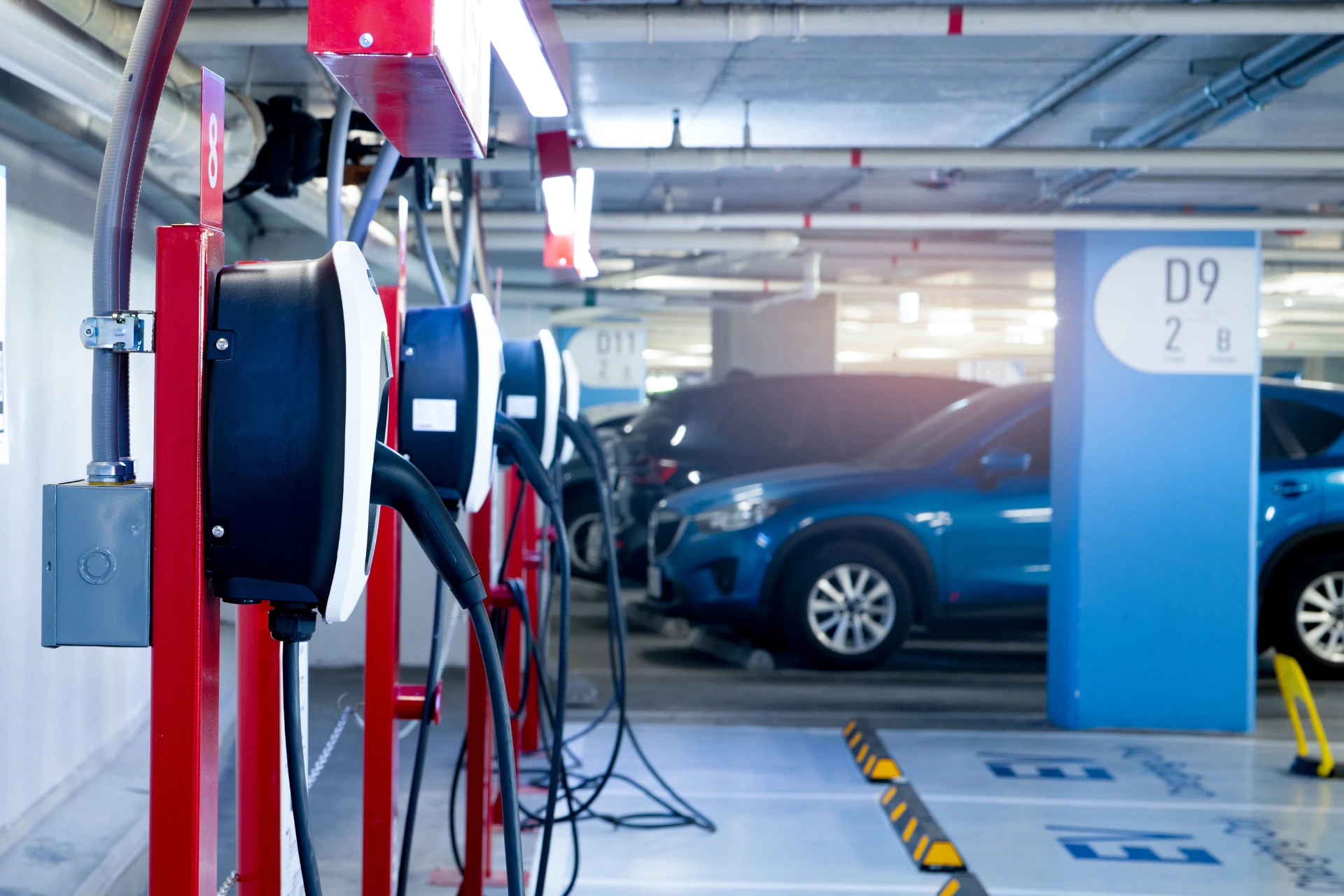 Electric vehicle being loaded onto an enclosed car transport trailer for safe shipping in 2025.