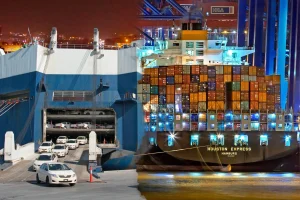 Comparison of a Ro-Ro ship loading cars and a container ship loaded with cargo boxes, illustrating Ro-Ro vs. Container Shipping.